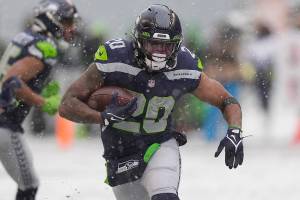 Seattle Seahawks running back Rashaad Penny carries against the Chicago Bears during the second half of an NFL football game, Sunday, Dec. 26, 2021, in Seattle. (AP Photo/Stephen Brashear)