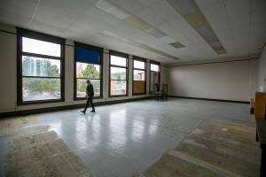 Monroe Historical Society board president Valeria Rae walks around the upstairs space, formerly the library, at the historical society’s downtown building on Wednesday, March 23, 2022, in Monroe, Washington. The space is being renovated to create an area for community members to hold meetings, and to retain most of the space’s original charm. (Ryan Berry / The Herald)