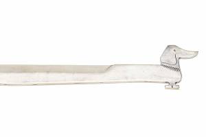"Wiener" dogs may not come from Vienna, but this gold-colored letter opener did. It was made by Werkstatte Hagenauer and sold for $813 at a Rago auction.