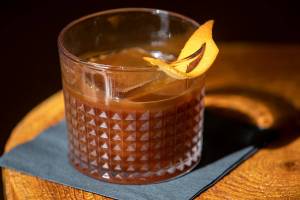 A non-alcoholic old fashioned, made with espresso, is prepared at Nadine’s Coffee House Friday, March 25, 2022, in Everett, Washington. (Ryan Berry / The Herald)