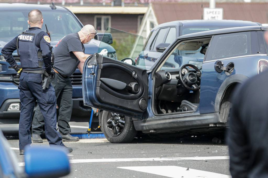 The vehicle of the suspect associated in the shooting of police officer is involved in a three car accident at 35th and Rucker Ave after three car accident in Everett, Washington on March 25, 2022. (Kevin Clark / The Herald)