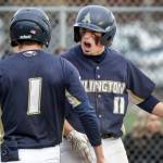 Arlingtons Aiden Green, left, and Arlingtons Trenton Lamie celebrate Lamies run against Snohomish Friday afternoon at Snohomish High School. The Eagles won 4-2. (Kevin Clark / The Herald)