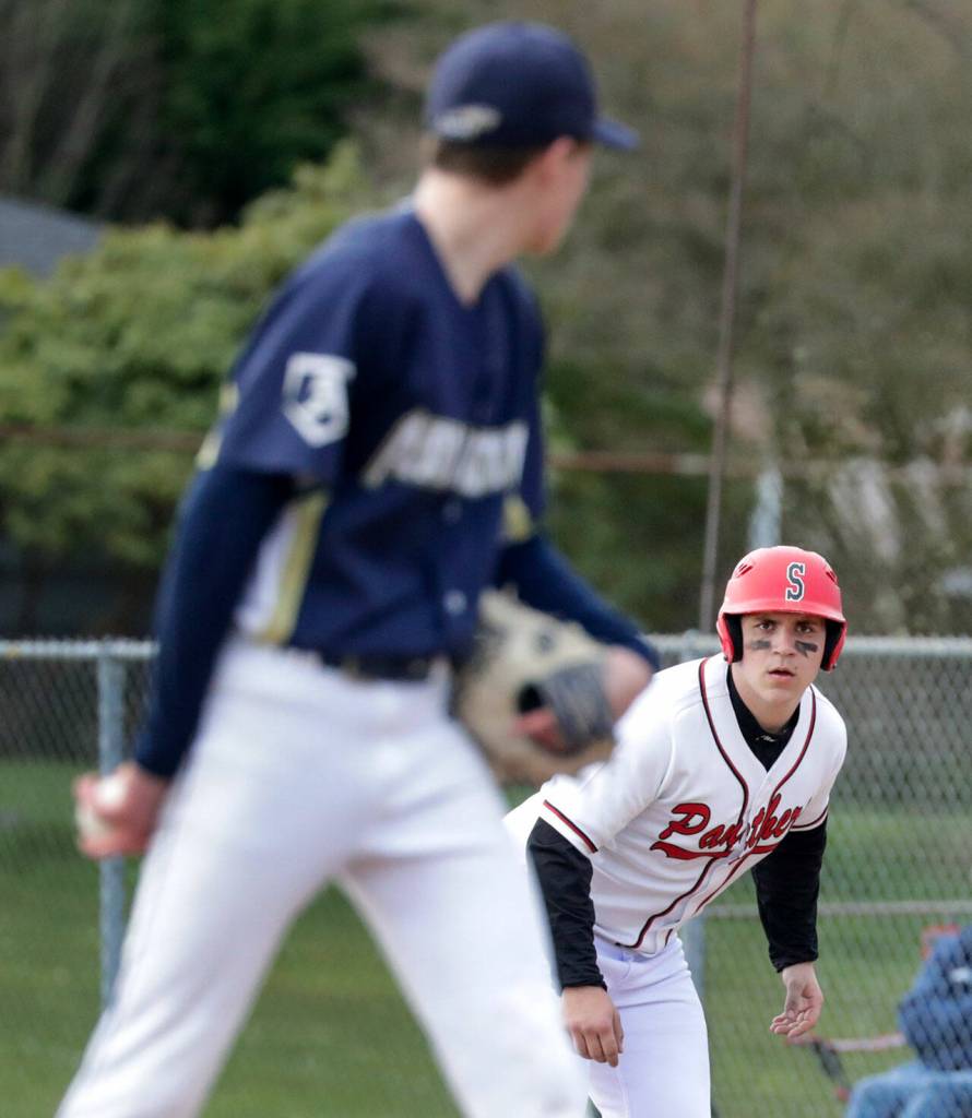 Arlingtons Ty Rusko, left, tracks Snohomishs Solomon Heineman Friday afternoon at Snohomish High School. The Eagles won 4-2. (Kevin Clark / The Herald)