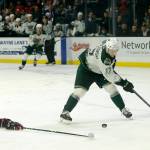 The Everett Silvertips Jackson Berezowski tries to control a lead pass against the Portland Winterhawks Saturday, March 26, 2022, at Angel of the Winds Arena in Everett, Washington. (Ryan Berry / The Herald)