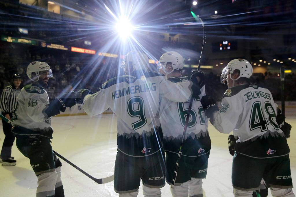 The Everett Silvertips celebrate a first period goal against the Portland Winterhawks Saturday, March 26, 2022, at Angel of the Winds Arena in Everett, Washington. (Ryan Berry / The Herald)