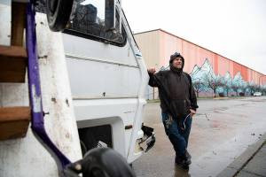Ed Hunt stands outside his RV on Cornwall Avenue on March 16. Hunt has lived along the road for more than a year. (Hailey Hoffman/Cascadia Daily News)