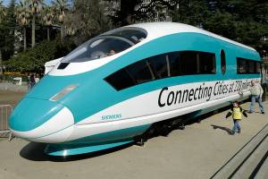FILE - A full-scale mock-up of a high-speed train, is displayed at the Capitol in Sacramento, Calif., on Feb. 26, 2015. The California High-Speed Rail Authority's biennial business plan, released Tuesday, Feb. 8, 2022, shows the estimated cost of the project rising by about $5 billion, compared to the 2020 plan, up to as much as $105 billion. (AP Photo/Rich Pedroncelli, File)