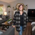 Shelly Henderson stands in her remodeled living room, which was designed by Kelly DuByne. (Andy Bronson)