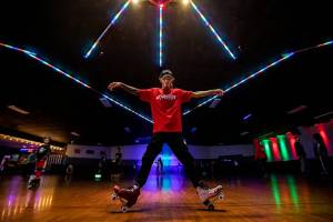Joseph Cordell, a long time patron of the Everett Skate Deck, demonstrates some of his skate moves in the center of the floor during the final open skate session at the Everett Skate Deck on Sunday, April 3, 2022. (Olivia Vanni / The Herald)