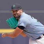 Seattle Mariners starting pitcher Robbie Ray throws during the first inning of a spring training baseball game against the Texas Rangers Monday, March 28, 2022, in Peoria, Ariz. (AP Photo/Charlie Riedel)