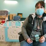 Shawna Priest, a member of the Jamestown S'Klallam Tribe, sits in the child-care area of the Jamestown Healing Clinic where she works as a medical assistant, Wednesday, Feb. 2, 2022, in Sequim, Wash., as she talks about the battles her son and daughter have had with opioid addiction. The tribe is building a full-service health center to treat both tribal members and other community residents for opioid addictions. Earlier in the week, Native American tribes across the U.S. settled a lawsuit against drug maker Johnson & Johnson and the largest three drug distribution companies in the U.S. for $590 million. The money won't be distributed quickly, but tribal leaders say it will play a part in healing their communities from an epidemic that has disproportionately killed Native Americans. (AP Photo/Ted S. Warren)