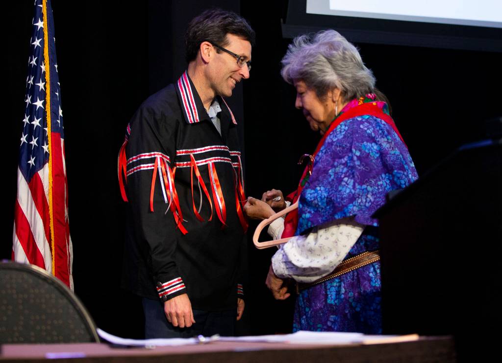 Attorney General Bob Ferguson receives a ribbon shirt on March 31 during the bill-signing ceremony in Tulalip. (Olivia Vanni / The Herald)