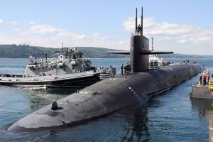Tugs guide the Ohio-class ballistic missile submarine USS Louisiana to its berth at Naval Base Kitsap-Bangor in 2012. (U.S. Navy)