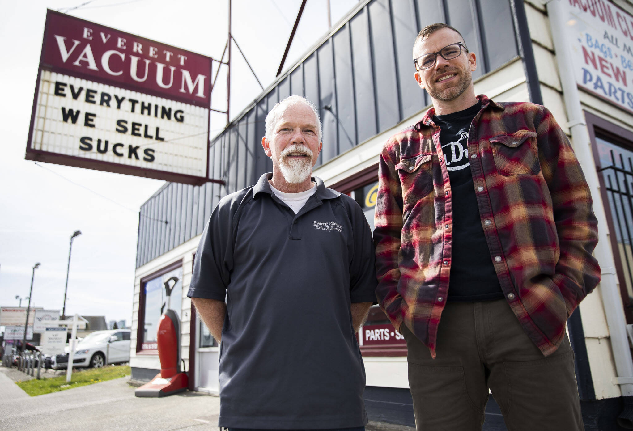 Mike Lane (left) and his son, David Lane, in front of their family store, Everett Vacuum. (Olivia Vanni / The Herald)