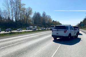 Responders block off traffic at the site of a Wednesday morning crash on I-5 near Arlington that left one person dead. (Washington State Patrol)