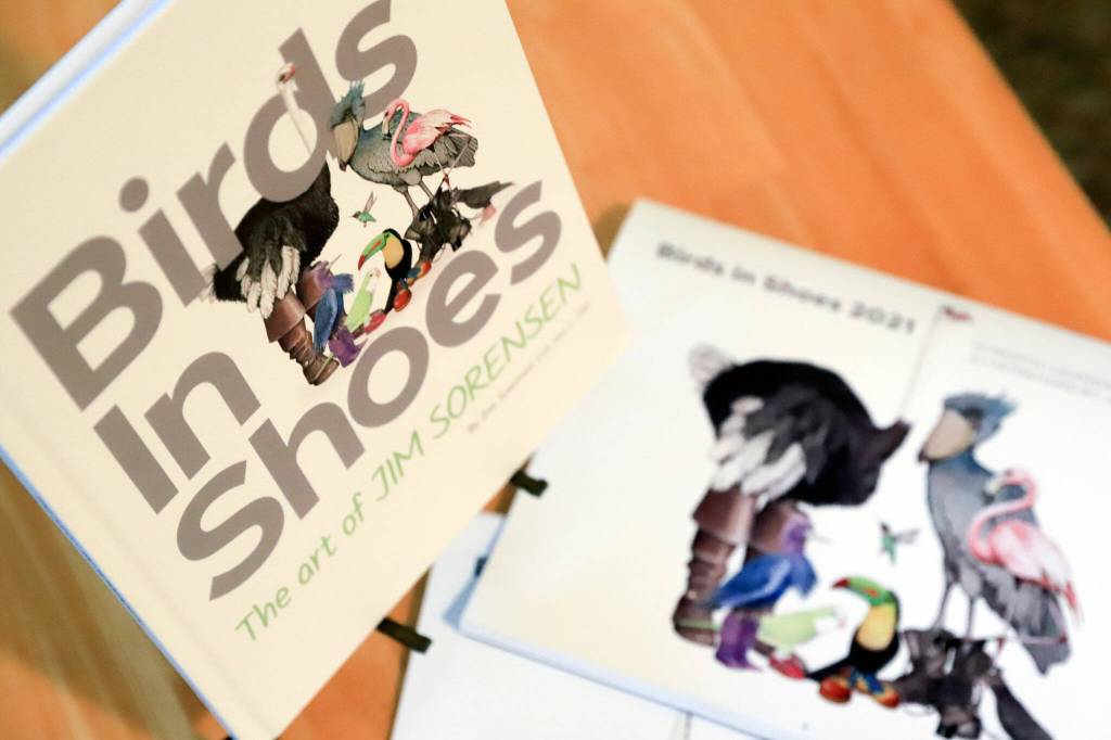 Artist Jim Sorensens drawings are featured in a calendar and a book. (Kevin Clark / The Herald)