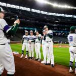 Edmonds-Woodway players pose for photos on the field before the game. (Olivia Vanni / The Herald)