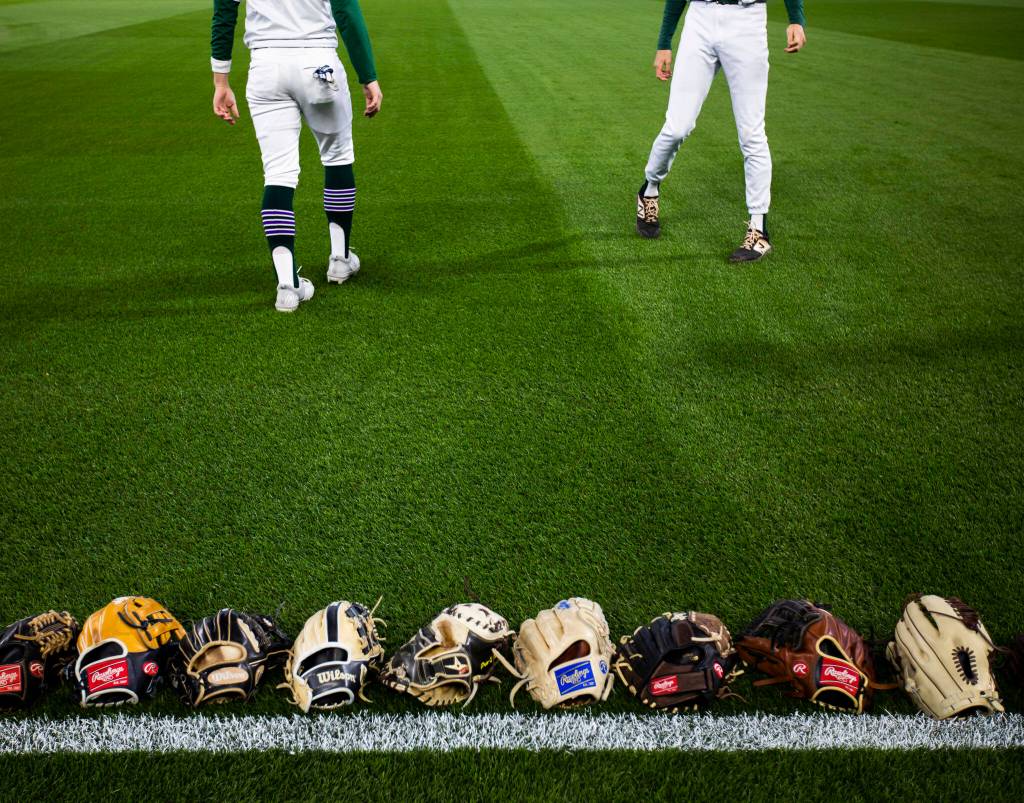 Edmonds-Woodway players warm up before the game against Kentwood at T-Mobile Park on Friday, April 8, 2022 in Seattle, Washington. (Olivia Vanni / The Herald)