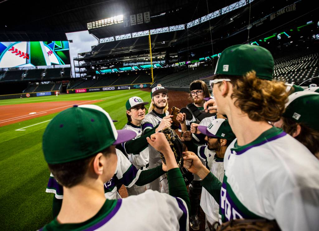 Edmonds-Woodway players cheer before heading out onto the field at T-Mobile Park on Friday, April 8, 2022 in Seattle, Washington. (Olivia Vanni / The Herald)