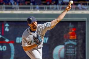 Seattle Mariners starting pitcher Robbie Ray (38) throws against the Minnesota Twins in the second inning of a baseball game, Friday, April 8, 2022, in Minneapolis. (AP Photo/Nicole Neri)
