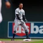 Seattle Mariners center fielder Julio Rodriguez (44) reacts after doubling on a line drive to Minnesota Twins center fielder Byron Buxton (25) during the ninth inning of a baseball game Saturday, April 9, 2022, in Minneapolis. Seattle won 4-3. (AP Photo/Stacy Bengs)