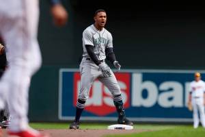 Seattle Mariners center fielder Julio Rodriguez (44) reacts after doubling on a line drive to Minnesota Twins center fielder Byron Buxton (25) during the ninth inning of a baseball game Saturday, April 9, 2022, in Minneapolis. Seattle won 4-3. (AP Photo/Stacy Bengs)