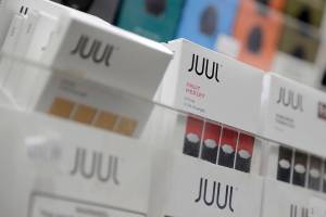 FILE - Juul products are displayed at a smoke shop in New York, on Dec. 20, 2018. Tobacco giant Altria said Tuesday, Feb. 15, 2022, that an administrative law judge has dismissed a federal lawsuit alleging the company's partnership with e-cigarette maker Juul Labs amounted to an anticompetitive agreement that hurt consumers. (AP Photo/Seth Wenig, File)