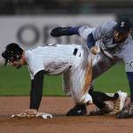 The Mariners Abraham Toro (right) collides with the White Soxs Adam Engel after forcing him out at second base during the second inning of a game Wednesday in Chicago. (AP Photo/Paul Beaty)