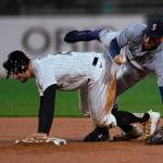 Seattle Mariners' Abraham Toro, right, collides with Chicago White Sox's Adam Engel after forcing him out at second base during the second inning of a baseball game Wednesday, April 13, 2022, in Chicago. Chicago won 6-4. (AP Photo/Paul Beaty)