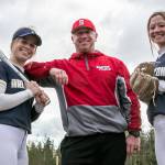 Arlington’s Riley Ryan, left, and Reagan Ryan with their father Patrick Ryan, Stanwood’s head coach Monday afternoon at Arlington High School in Arlington, Washington on April 11, 2022. (Kevin Clark / The Herald)