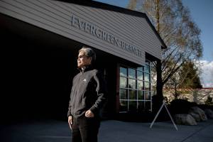 Artist Stuart Nakamura, who was elected to create some public art in Everett reflecting on COVID, outside of the Everett Library Evergreen Branch where his art piece will be displayed on Tuesday, April 19, 2022 in Everett, Washington. (Olivia Vanni / The Herald)