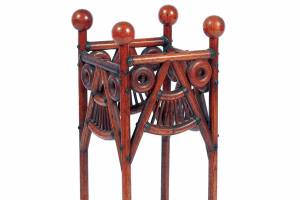 Photo Caption: This stick and ball umbrella stand shows that not all Arts and Crafts furniture is plain and dark. It sold for $300 at a recent Selkirk auction.

(c) 2022 by Cowles Syndicate Inc.