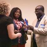 Theresa and Joesph Bervell, the parents of Emerging Leaders winner Joel Bervell, accept the award on his behalf at a ceremony on Wednesday in Everett. (Olivia Vanni / The Herald)