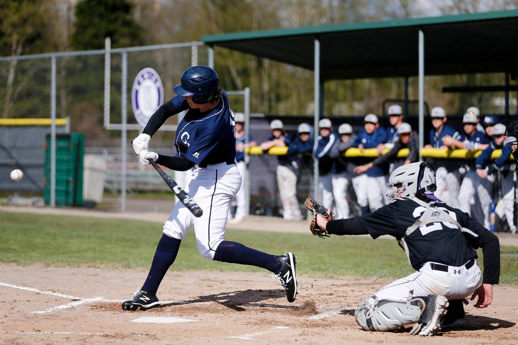 Glacier Peaks Karsten Sweum fouls off a pitch against Kamiak Friday, April 15, 2022, at Kamiak High School in Mukilteo, Washington. (Ryan Berry / The Herald)