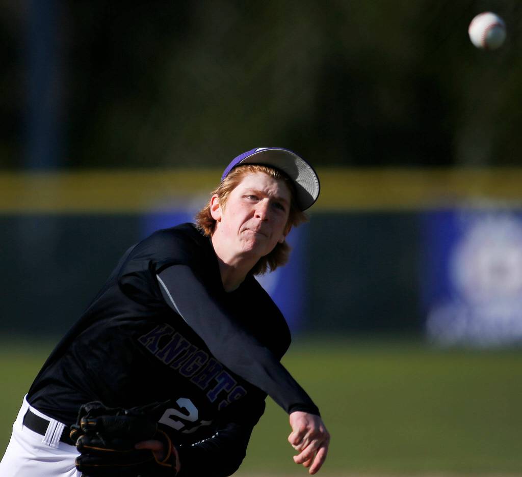 Kamiaks Atticus Manning delivers a pitch against Glacier Peak Friday, April 15, 2022, at Kamiak High School in Mukilteo, Washington. (Ryan Berry / The Herald)