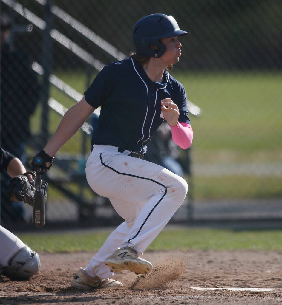 Glacier Peaks Colby Holmdahl knocks the ball through the infield for an RBI against Kamiak Friday, April 15, 2022, at Kamiak High School in Mukilteo, Washington. (Ryan Berry / The Herald)