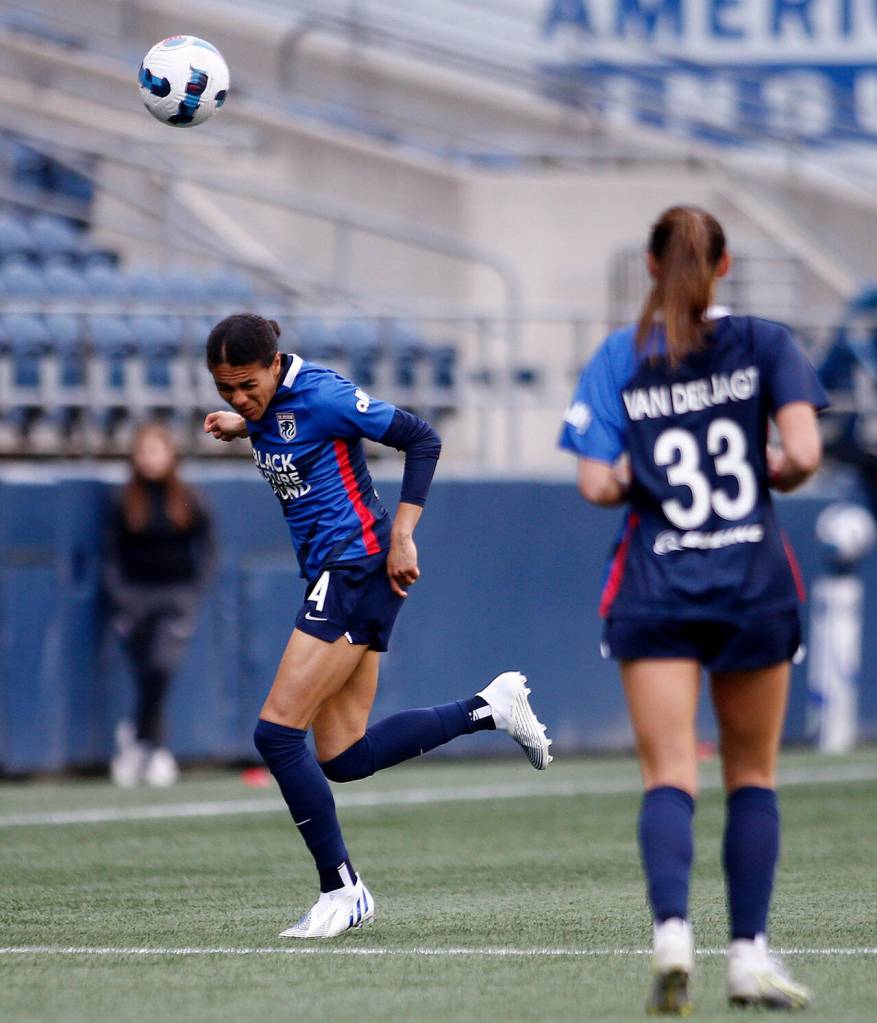 OL Reigns Alana Cook heads away a deep pass during a NWSL Challenge Cup matchup against Angel City FC Sunday, April 17, 2022, at Lumen Field in Seattle, Washington. (Ryan Berry / The Herald)