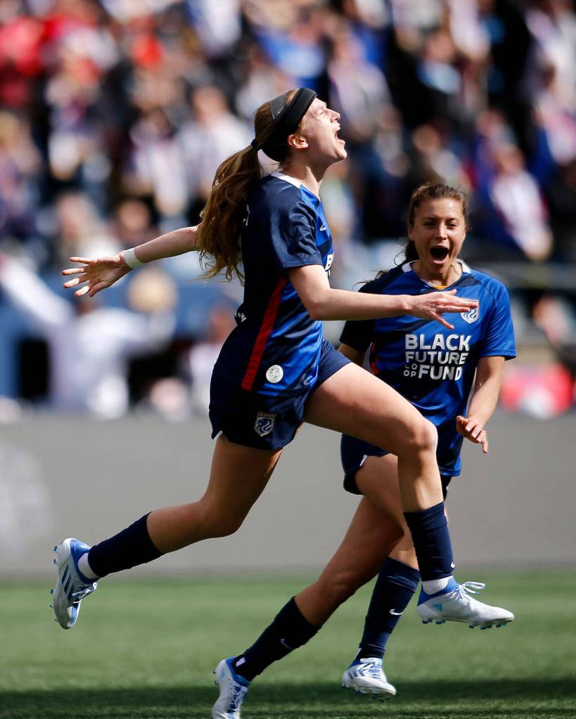 OL Reigns Bethany Balcer celebrates a first half goal during a NWSL Challenge Cup matchup against Angel City FC Sunday, April 17, 2022, at Lumen Field in Seattle, Washington. (Ryan Berry / The Herald)