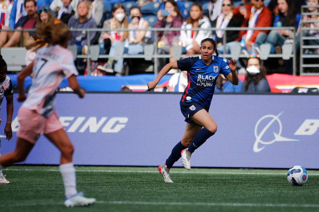 OL Reigns Jimena Lopez runs the ball up the sideline during a NWSL Challenge Cup matchup against Angel City FC Sunday, April 17, 2022, at Lumen Field in Seattle, Washington. (Ryan Berry / The Herald)