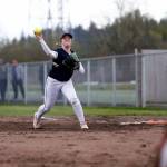 Arlingtons Tayler Stevens tries to throw out a runner at home against Snohomish Tuesday, April 19, 2022, at Snohomish High School in Snohomish, Washington. (Ryan Berry / The Herald)