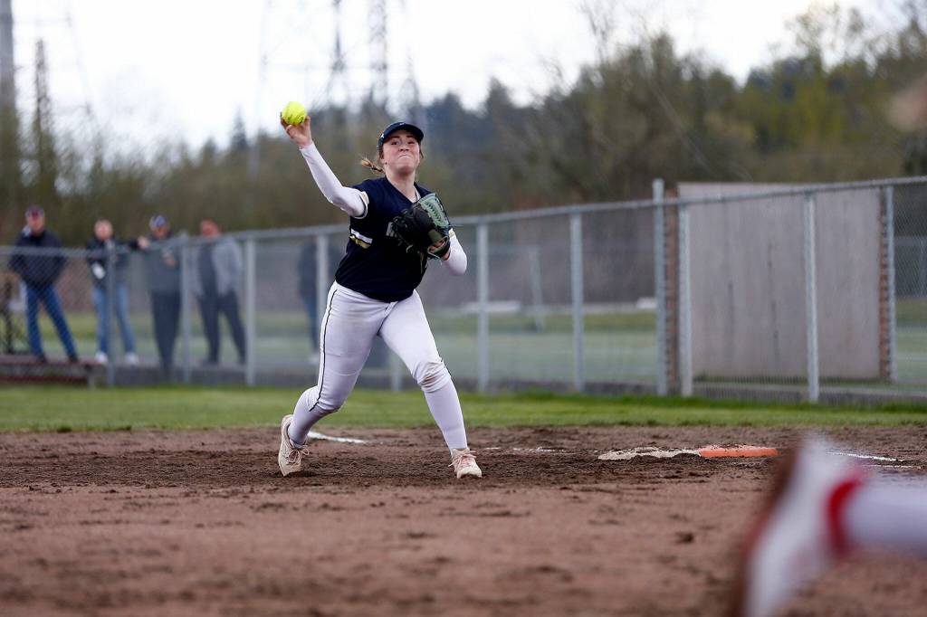 Arlingtons Tayler Stevens tries to throw out a runner at home against Snohomish Tuesday, April 19, 2022, at Snohomish High School in Snohomish, Washington. (Ryan Berry / The Herald)