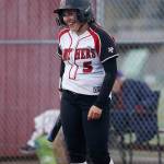 Snohomish leadoff batter Alli Wilson laughs after fouling off consecutive pitches against Arlington Tuesday, April 19, 2022, at Snohomish High School in Snohomish, Washington. (Ryan Berry / The Herald)
