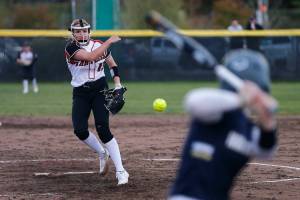 Snohomish’s Alex Flohr delivers a pitch against Arlington Tuesday, April 19, 2022, at Snohomish High School in Snohomish, Washington. (Ryan Berry / The Herald)