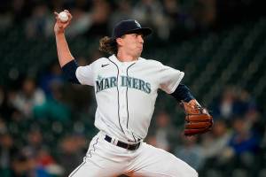 Seattle Mariners starting pitcher Logan Gilbert throws to a Texas Rangers batter during the first inning of a baseball game Wednesday, April 20, 2022, in Seattle. (AP Photo/Ted S. Warren)