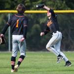 Monroes Eli Miller makes a catch during the game against Arlington on Thursday, April 21, 2022 in Arlington, Washington. (Olivia Vanni / The Herald)