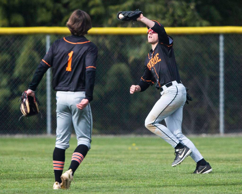 Monroes Eli Miller makes a catch during the game against Arlington on Thursday, April 21, 2022 in Arlington, Washington. (Olivia Vanni / The Herald)