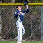 Arlingtons Jake Willis makes a catch in the outfield during the game against Monroe on Thursday, April 21, 2022 in Arlington, Washington. (Olivia Vanni / The Herald)