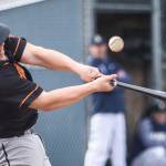 Monroes Rylan Hampton hits the ball during the game against Arlington on Thursday, April 21, 2022 in Arlington, Washington. (Olivia Vanni / The Herald)