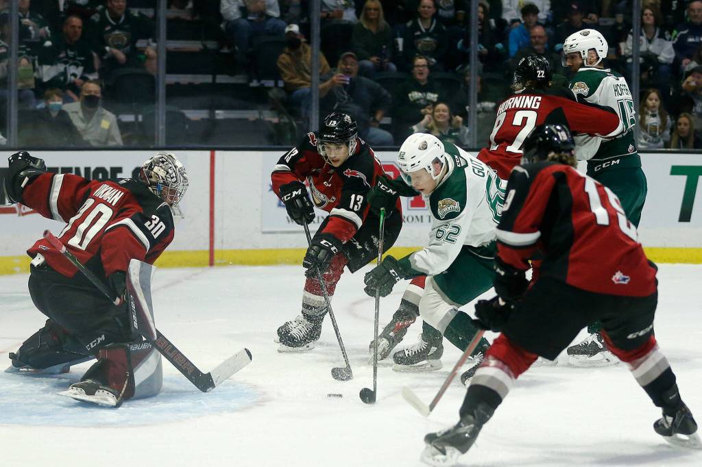 The Everett Silvertips&rsquo; Michal Gut gets the puck to the goal crease against the Vancouver Giants during the first round of the WHL playoffs Friday, April 22, 2022, at Angel of the Winds Arena in Everett, Washington. (Ryan Berry / The Herald)
