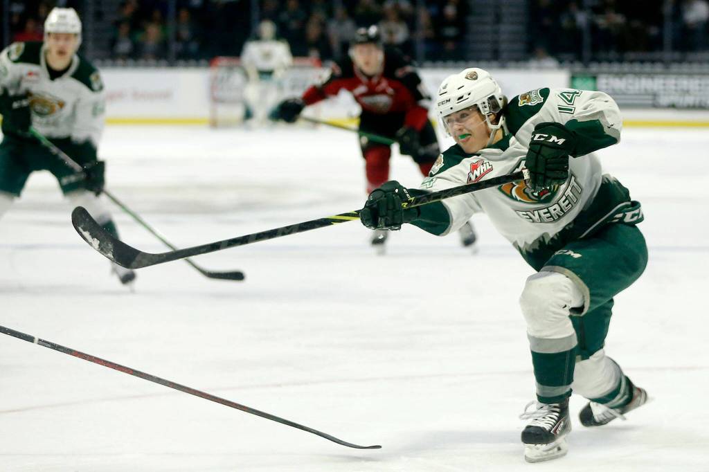 The Everett Silvertips&rsquo; Austin Roest puts a shot on net against the Vancouver Giants during the first round of the WHL playoffs Friday, April 22, 2022, at Angel of the Winds Arena in Everett, Washington. (Ryan Berry / The Herald)
